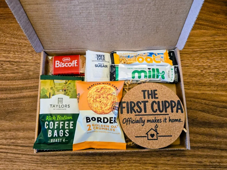 First Cuppa coffee housewarming gift with a coaster, coffee and biscuit treats