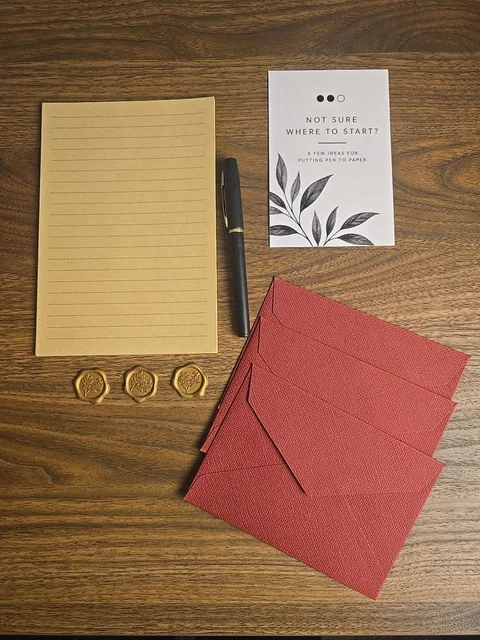 Writing paper, wine-red envelopes, pen, wax seal stickers and prompt card